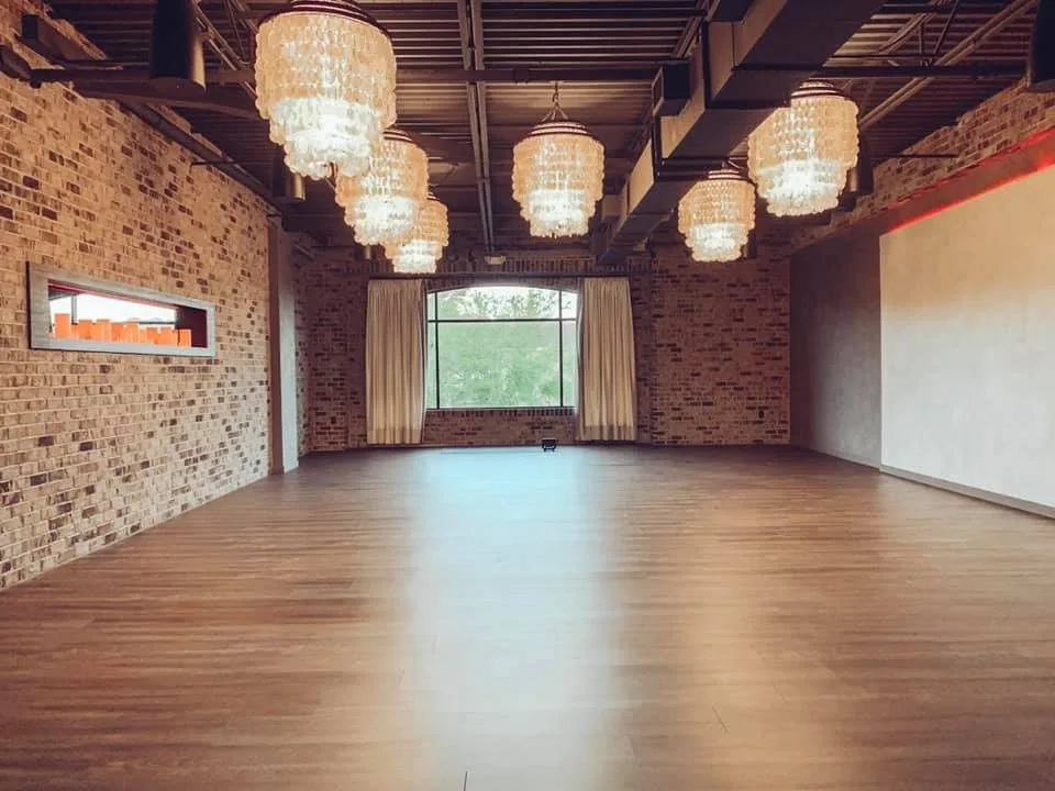 Warm chandelier light in the Red Skies studio